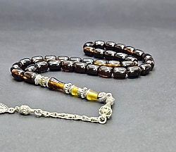 NAKKAŞLI PÜSKKÜLLÜ SIKMA KEHRİBAR.