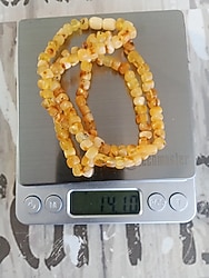 Damla Kehribar kolye resimde gram bilgisi vardir 14 gram 62 cm